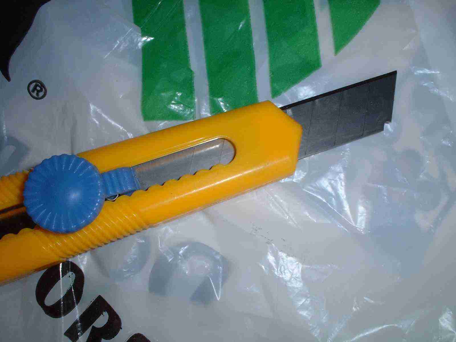 3-in-1 Tool with its box cutting blade extended