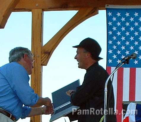 Author Greg Palast shows Wisconsin politician Ed Garvey some of Katherine Harris' software at Fighting Bob Fest