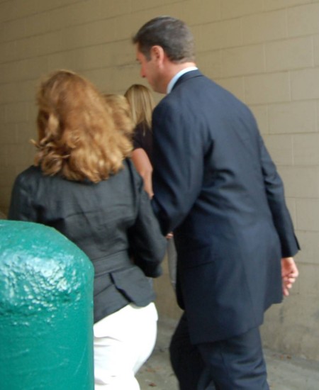 Allen flees reporters with his wife, photo by Pam Rotella